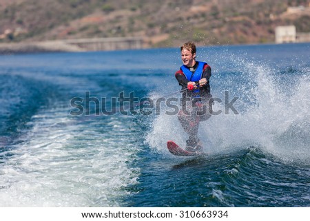 Water Skiing Fun\
Teen boy water skiing single ski slalom fun action
