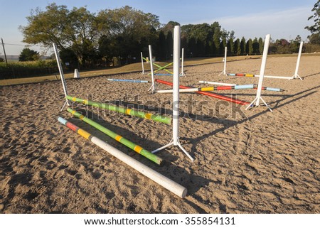 Equestrian Horse Jumping Poles\
Equestrian horse practice arena jumping gate poles morning countryside.