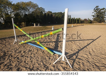 Equestrian Horse Jumping Poles
Equestrian horse practice arena jumping gate poles morning countryside.
