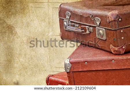 retro valise bags suitcases  on the old vintage textured paper background collection