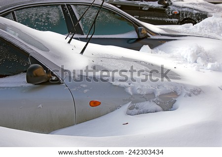 Odessa, Ukraine - 30 December, 2014: car under snow, Natural disasters, blizzard, heavy snow paralyzed the city, collapse. Snow covered cars cyclone Europe