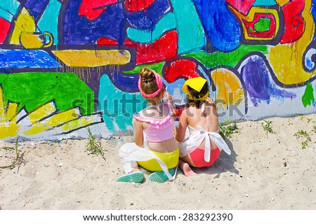 Odessa, Ukraine - 31 May 2015: Opened openair Festival of street art. Beautiful street art graffiti. Abstract creative drawing fashion colors on the walls of the city. People draws on a wall