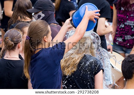 Odessa, Ukraine - 1 July 2015:  Openair water battle. Many happy people play pour water on each other celebrating festival