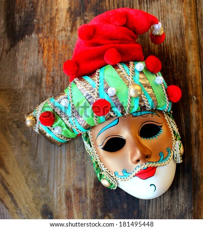 Beautiful venetian masquerade mask in a red hat for the carnival in Venice