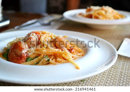 Delicious pasta spaghetti with shrimps and other seafood in the restaurant