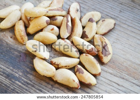 Bunch of Brazil nuts on wooden table