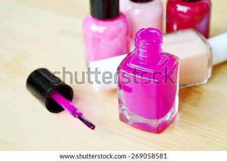 A bottle of violet nail polish closeup