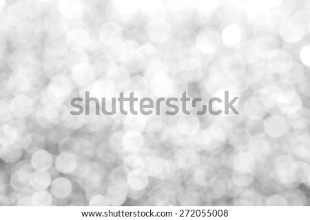 Bright and abstract blurred white silver background with shimmering glitter