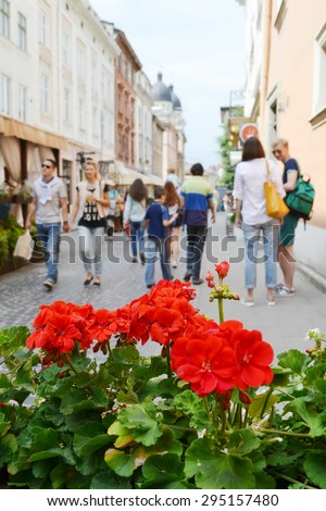 LVIV, UKRAINE - JUNE 29, 2015: cityscape of Lviv downtown, summer flowers and people