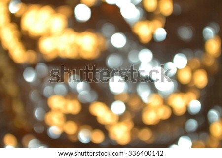 Bright and abstract blurred star golden and white silver background with shimmering glitter