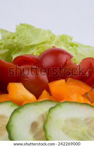 Iceberg Lettuce, Cherry Tomato, Orange Pepper And Cucumber