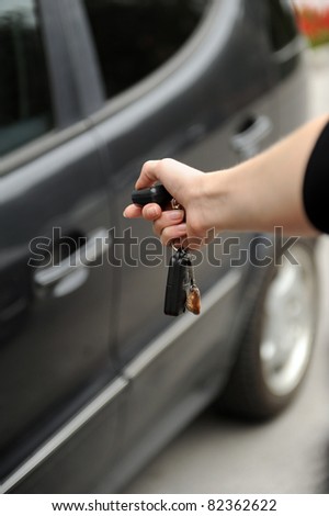 women holding key of her new auto