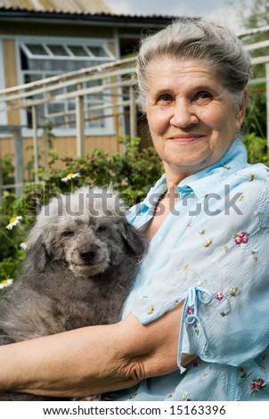 Portrait of old lady with old funny dog