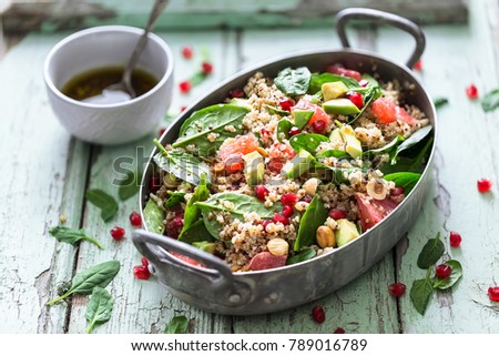 Winter Salad with Quinoa, Blood Orange, Spinach, Avocado, Pomegranate, Hazelnuts and Bulgur