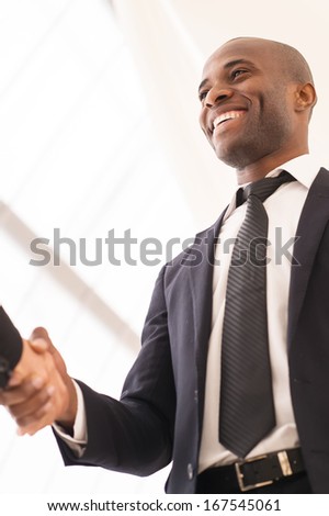 Good deal. Close-up of low angle view of business men shaking hands