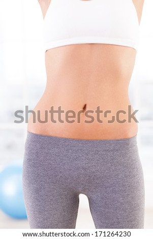 Perfect forms. Cropped image of young woman in sports clothing