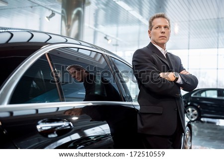 Dreaming Of A New Car. Thoughtful Grey Hair Man In Formalwear Leaning At The Car And Looking Away