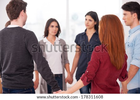 Trust circle. Group of people standing in circle and holding hands
