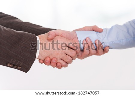 Handshake. Close-up of two business men shaking hands