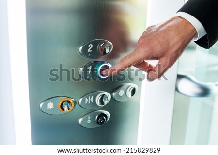 Man pushing button. Close-up of male hand pushing button of elevator