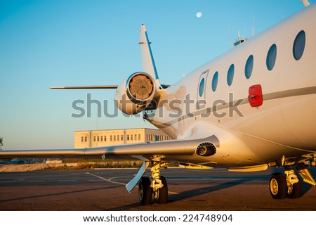 Corporate jet. Close-up of jet airplane is landing in airport