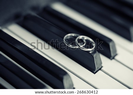 Wedding ring. Two wedding ring laying on piano keys