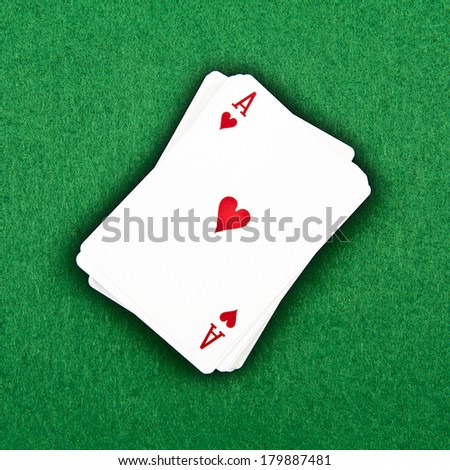 A deck of cards on a green background