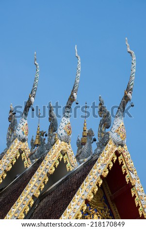 Beautiful gable apex on the roof of royal temple in Phare, Thailand..