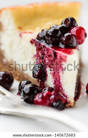 Cheese cake slice with mixed berries topping