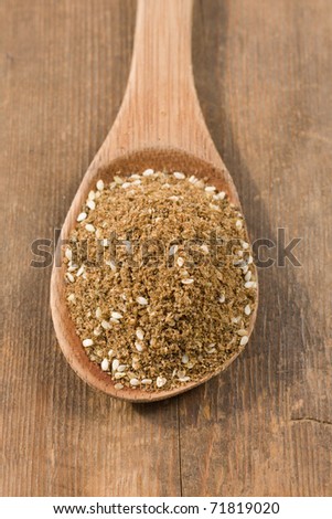 Za\'atar is a Middle Eastern spice mixture, a blend of herbs, toasted sesame seeds  and salt. Frequently used as a spread on bread.