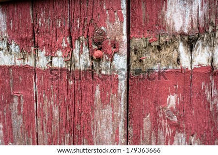 An old wooden door painted in red