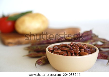 Red french beans in a clay salad dish