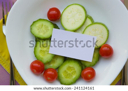 Free space for a text on a plate with raw vegetables. \