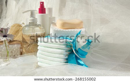 Hygiene set for a baby: liquid soap,cotton sticks,shower,diapers,cosmetic discs,soap,gel,lotion,antiseptic,physiological liquid.Free space for a text