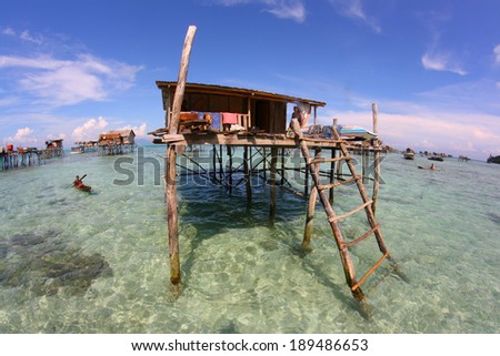 SEMPORNA, SABAH, MALAYSIA - NOV 4 :A Bajau Laut stilt house on Nov 4, 2013 in Semporna, Sabah, Malaysia. The Bajau laut stilt houses are built on shallow water at nearby islands of Semporna water.