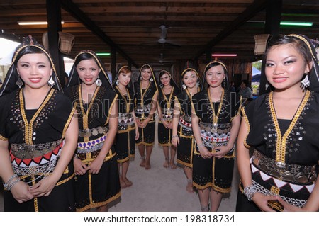 KOTA KINABALU, MALAYSIA - MAY 31 : Dusun Liwan ladies in their traditional costume welcome the public during Harvest Festival celebration May 31, 2013 in Kota Kinabalu, Sabah, Malaysia.