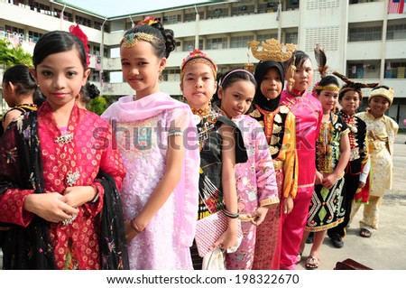 KOTA KINABALU, MALAYSIA - SEPTEMBER 14 : Children of SK Kolombong in Malaysia multi race costume to commemorate Malaysia Day on September 14, 2012 in Kota Kinabalu, Sabah, Malaysia.
