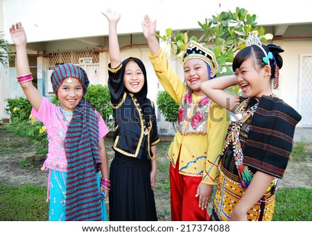 KOTA KINABALU, MALAYSIA - SEPTEMBER 12 : Children of SK Kolombong in Malaysia multi-racial costumes to commemorate Malaysia Day on September 12, 2014 in Kota Kinabalu, Sabah, Malaysia.