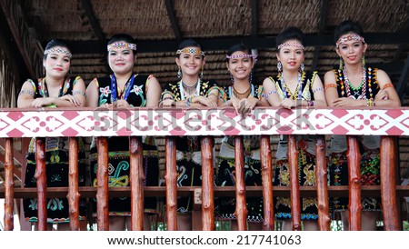 SIPITANG, SABAH, MALAYSIA - August 30, 2014 : A group of  ladies in their from the Murut ethnicity stand at the veranda of their traditional house during the GaTa festival in Sipitang, Sabah.