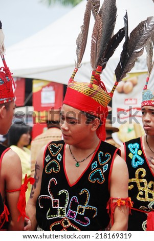 Sipitang, Sabah Malaysia.August 30, 2014 : A man from the Murut ethnic in their traditional warrior costume getting ready to welcome the guests during the GaTa festival in Sipitang Sabah Malaysia.