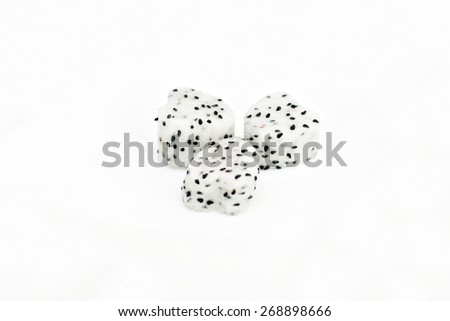 Three heart-shaped dragon fruit on white plate with clean white background. Image has selective focusing and suitable for background purposes only.