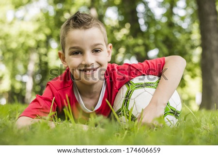 A young boy loves his soccer