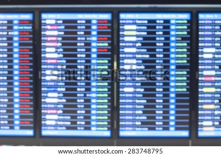 Blurred background : Flight Schedules Monitor at Airport