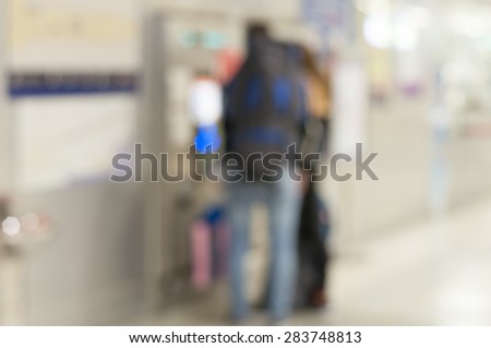 Blurred background : Traveler at ticket machine at Airport Rail Link - Suvarnabhumi Airport in Bangkok,Thailand