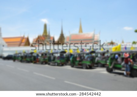 Blurred background : Traveler in the three-wheeler(Tuk-Tuk) travel around the Bangkok,Thailand