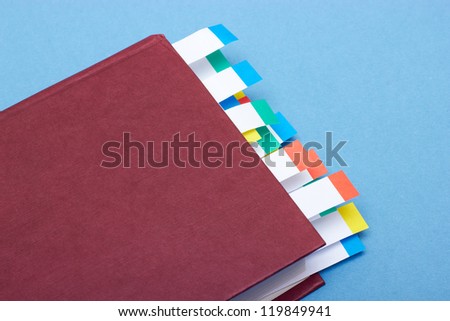 Book with colored paper index sticks