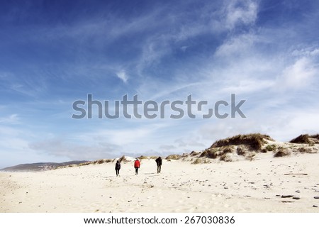 people walking on the beach of Razo ,Coast of death , Galicia, Spain