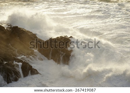 waves breaking on the cliffs on a stormy day in Corunna, Spain