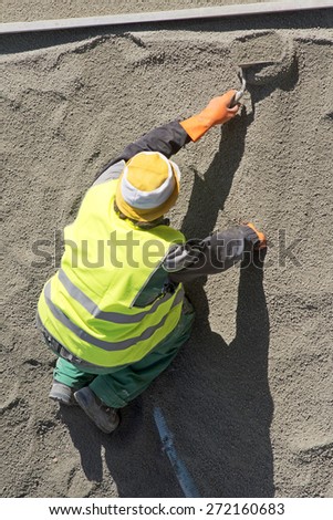 street construction worker repairing sidewalks and pipelines in the city