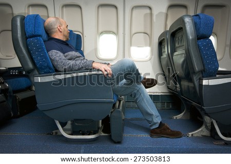 commercial airline passenger in comfortable seat  inside the plane